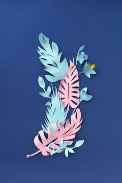 Paper summer flowers and leaves on a blue handmade for home deco