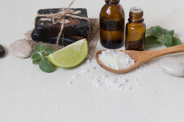 Natural sea salt and handmade soap with body oil on a white background SPA concept.