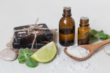 Natural sea salt and handmade soap with body oil on a white background SPA concept.