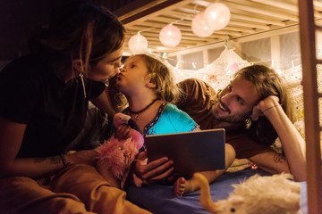 Content family with little girl at home