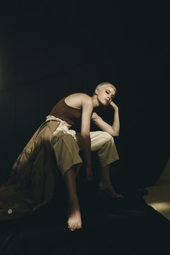 Fashion studio portrait of blonde stylish female.