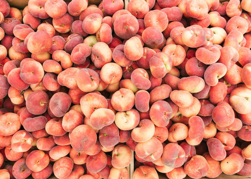 Pile of fresh donut peaches at Farmers Market, New York City