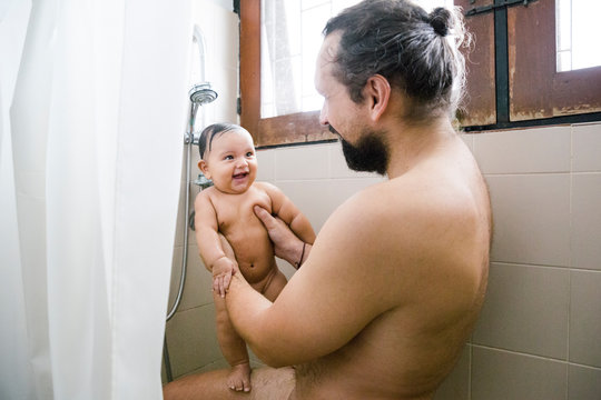 Father and Baby in Shower