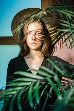 Sensual woman in shadow of leaves