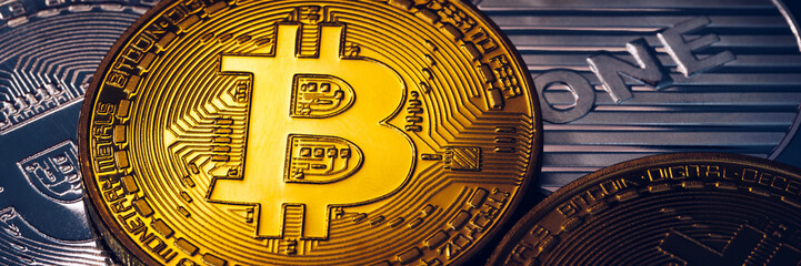 Stack of cryptocurrencies with a golden bitcoin. Bitcoin as most important cryptocurrency concept. Bitcoin. Physical bit coin. Digital currency. Cryptocurrency. Golden coin with bitcoin