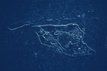 Vintage blue background. Rough painted wall of sapphire color. Imperfect plane of blue colored. Uneven old decorative toned backdrop of cyan tint. Texture of sapphirine hue. Ornamental stony surface.