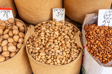 Fototapeta na wymiar Shuk levinsky market: fresh raw almonds, Tel Aviv, Israel