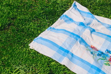 vintage blue picnic cloth on grass