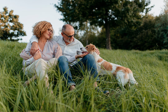 Stylish Senior Couple With Their Dog