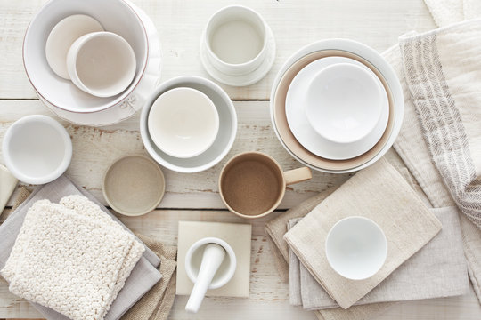 Various dishes on white wood surface