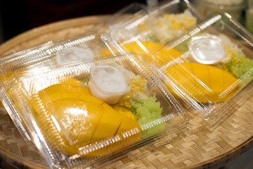 Sticky Rice with Yellow Mango and Durian in small piece of Clear box pack take home style stack on shelf ready to sell, Thai Style sweet dessert for Street Food