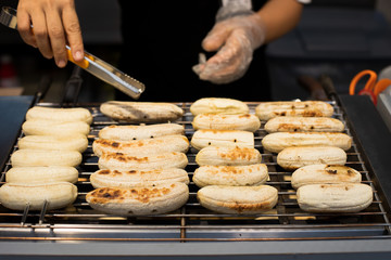 BBQ Banana on electronic fire heat oven, medium grill stack on shelf ready to sell, Thai Style sweet dessert for Street Food