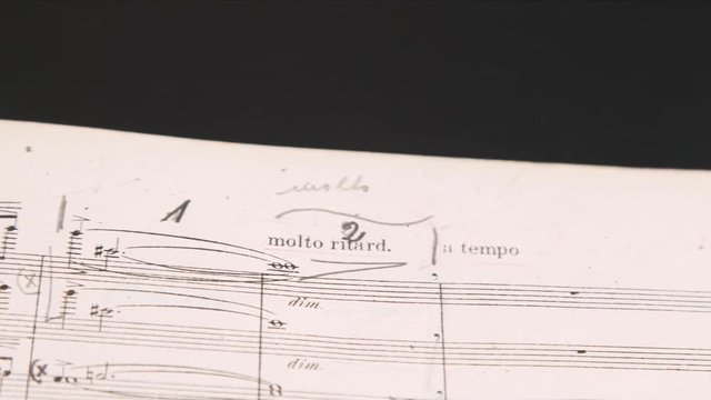 close up of  music score with hand notes
