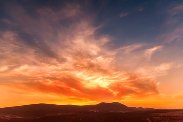 Fototapeta na wymiar stunning sunrise in the mountains in orange tones