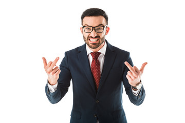 irritated businessman showing middle fingers while looking at camera isolated on white