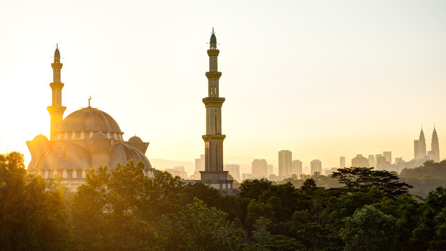 A View Of A Blue Mosque In Kuala Lumpur, Malaysia During Sunrise