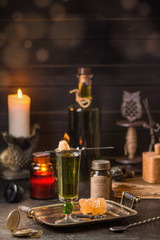 Absinthe poured into a tall glass.