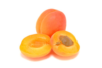 Ripe apricot on white background close-up