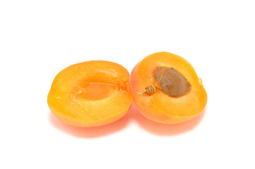 Ripe apricot on white background close-up