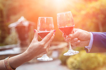 Just Married Couple in Hands Glasses with Red Wine.
