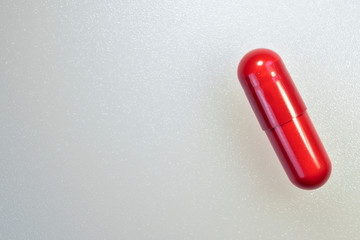 Red drug pill