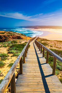Praia da Bordeira and boardwalks forming part of the trail of tides or Pontal da Carrapateira walk in Portugal. Amazing view of the Praia da Bordeira in portuguese. Bordeira, Algarve, Portugal.