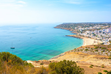 view on Praia da Luz in sunny day with turquoise Atlantic ocean, Algarve, Portugal