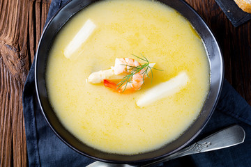 Super delicious asparagus soup with crab and capers .