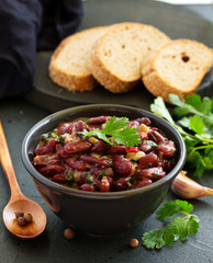 Stewed red beans with spices and cilantro, hot pepper. Lobio. Chile con carne.