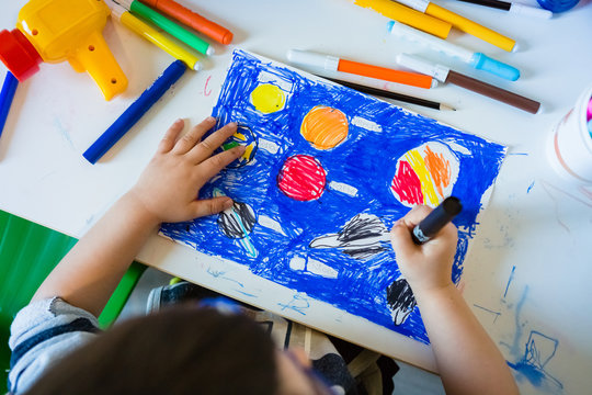 Kid Drawing and Coloring Solar System