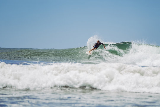 Guy surfing in Costa Rica