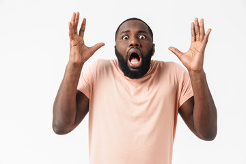 Fototapeta premium Portrait of a shocked african man wearing plaid shirt