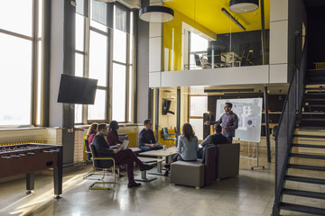 Business People Watching Presentation At The Open Space Office