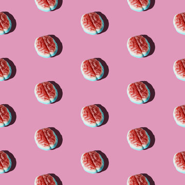 Brain candy arranged in a pattern on a pink background