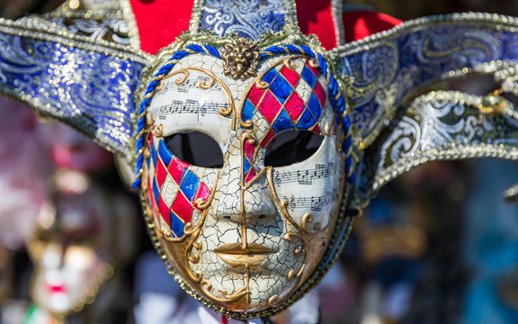 Group of Vintage carnival masks. Venetian masks in display in Venice. Annual carnival in Venice is the most famous in Europe. Its symbol is the Venetian mask. Venice, Italy.
