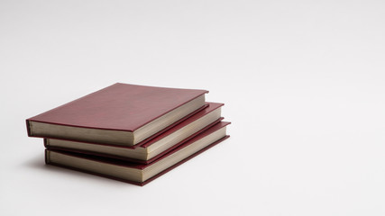 books with red cover on white background, isolated. back to school