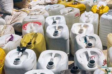 Large empty jugs waiting to be filled up by the local people on a small island off the coast of Colombia