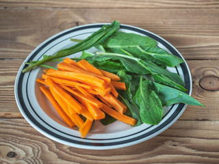 Useful snack from carrots and green sorrel