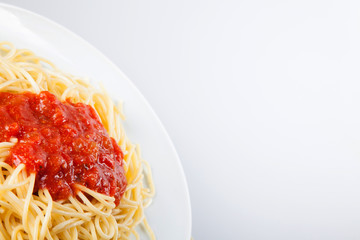 Macaroni with tomato sauce on white background