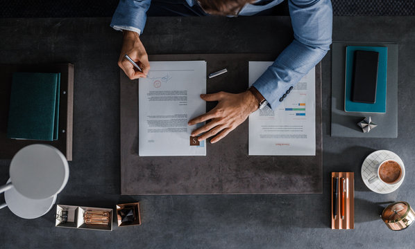 A Businessman Signing a Document