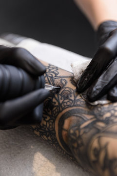 Closeup of tattooing machine in process