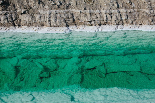 Calcium chloride mine tailings and canal in desert