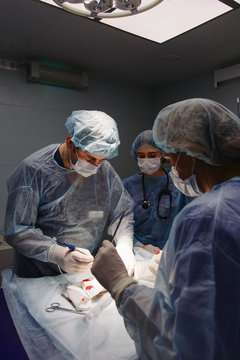 People providing operation in clinic