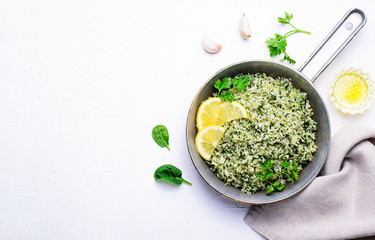 Spinach Rice in a Skillet over White Background