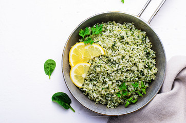 Spinach Rice in a Skillet over White Background