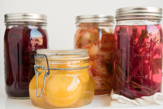Various jars of fermented and pickled food