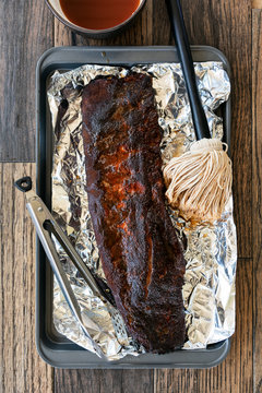 Smoked: Dry Rubbed Ribs Get Wet Mopped For Moisture