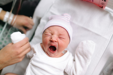 overhead view of yawning baby