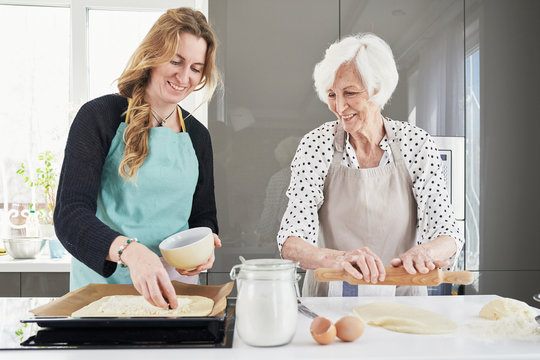 Woman Making Pie With Grandma
