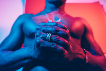 Portrait Of A Man Under Blue And Red Lights.